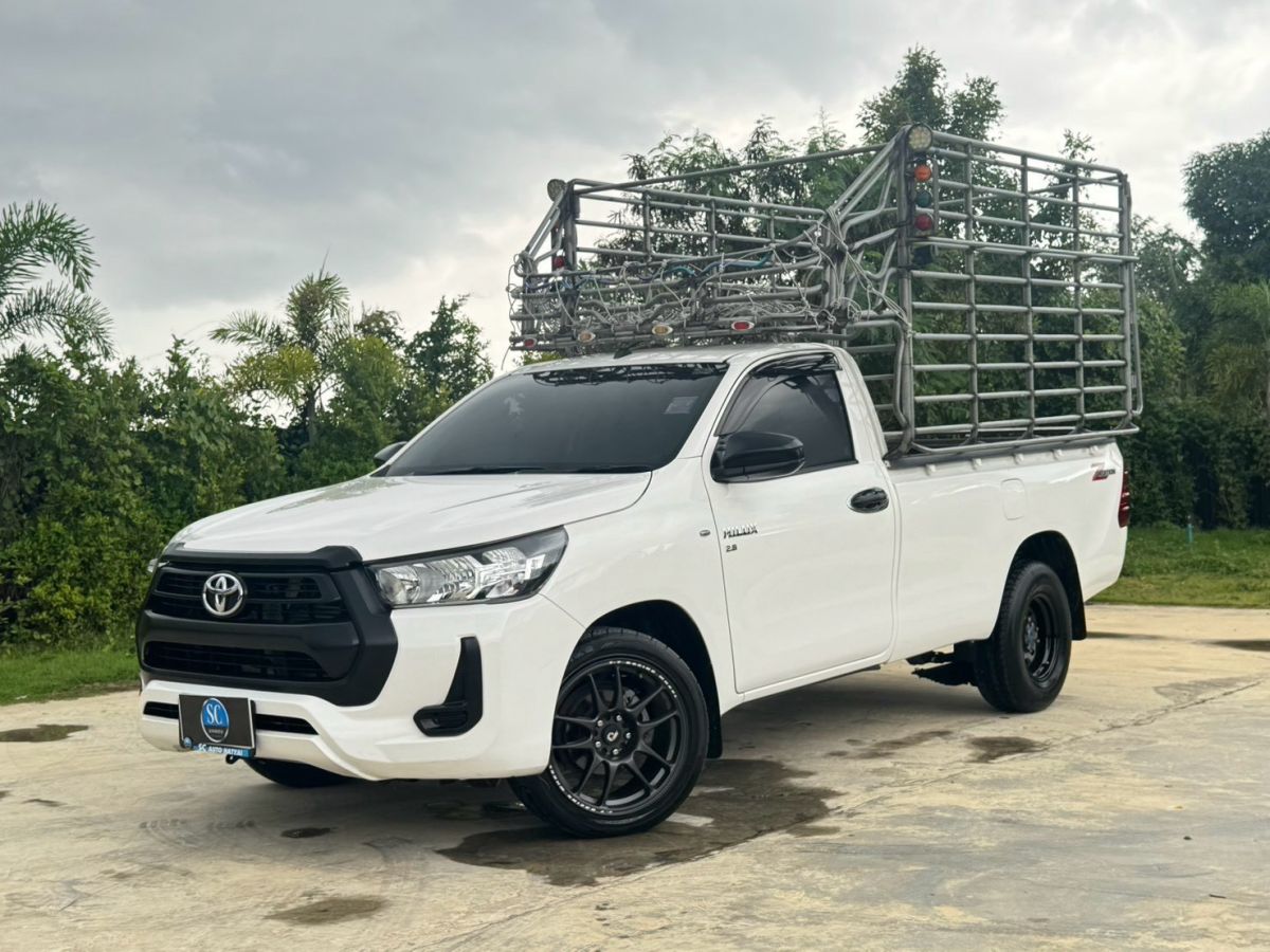 Front view of Toyota Hilux Revo Single Cab 2.8 Entry year 2022 white color used car with cargo rack in Hatyai
