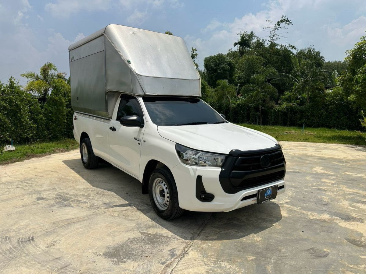 Front view of Toyota Hilux Revo Single Cab 2.8 Entry year 2021 white color used car with cargo box in Hatyai